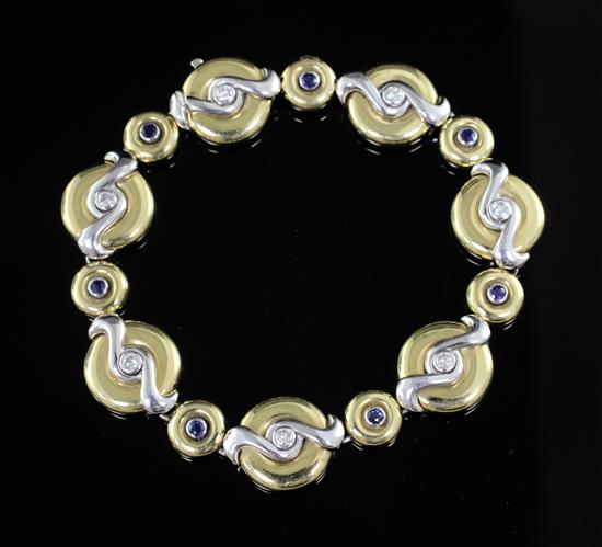 A Boodles & Dunthorne 18ct gold, sapphire and diamond graduated disc bracelet, 18.5cm.